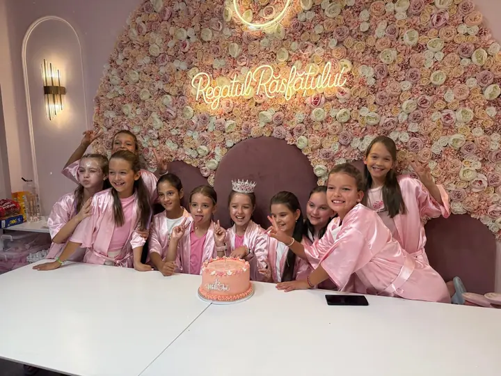 A party with a birthday cake, under our neon sign