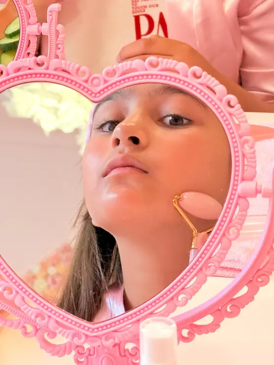 A mini facial in the heart-shaped mirror