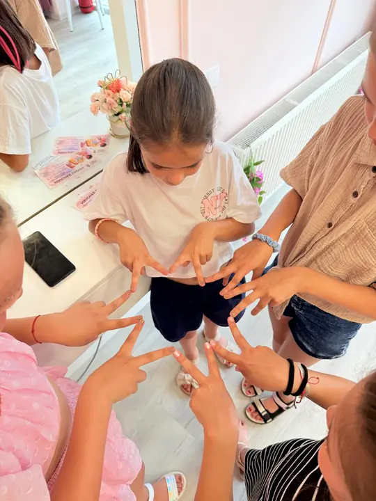 Friends showing off their freshly done nails