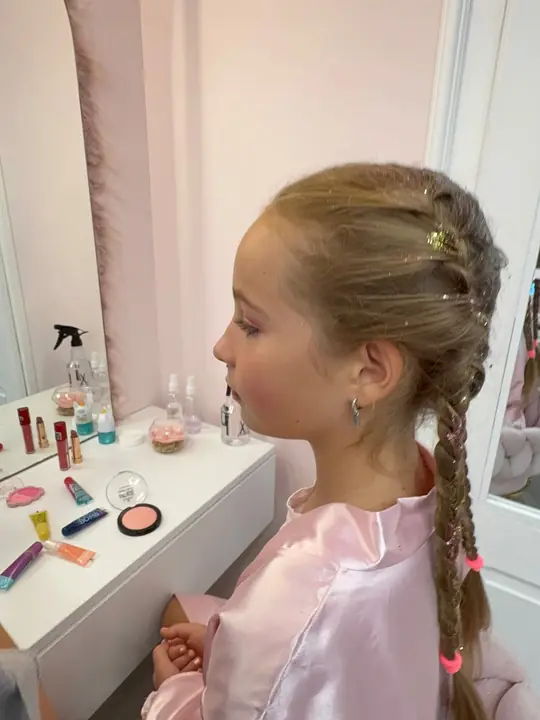 A hairstyle with braids and accessories
