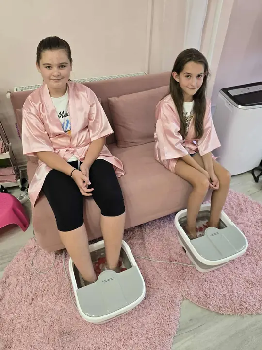 Two princesses at the mini spa, in pink robes